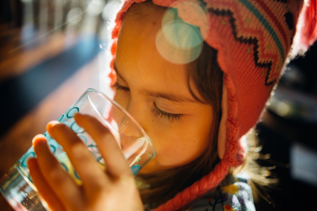 A girl in rural Guatemala drinking clean water
