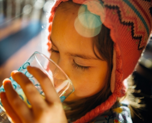 A girl in rural Guatemala drinking clean water