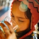 A girl in rural Guatemala drinking clean water
